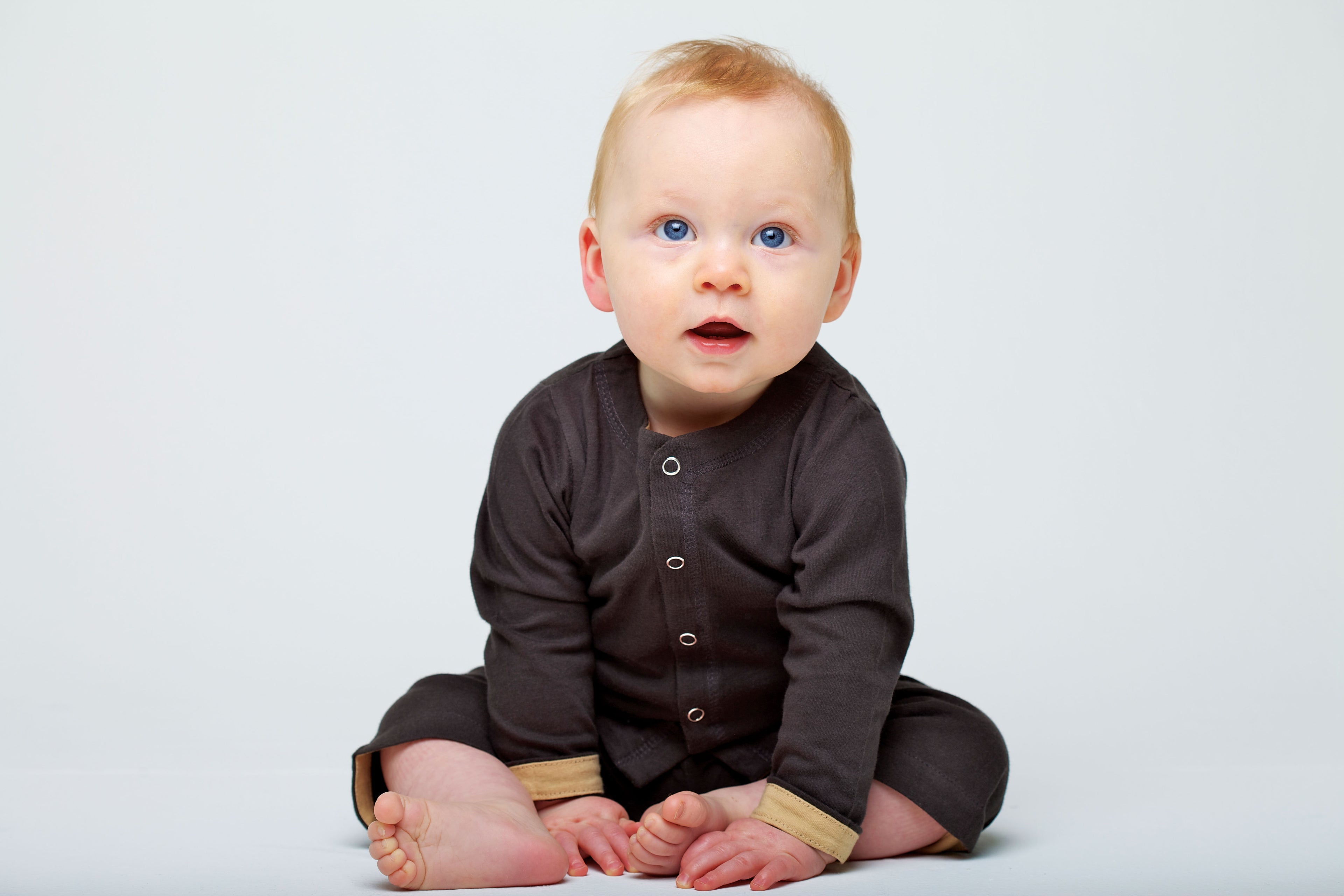 Baby wearing Horsey baby cashmere cotton long suit in grey charcoal with contrast cuff detail